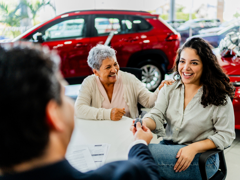 Fillback Ford Finance specialist handing keys to customer